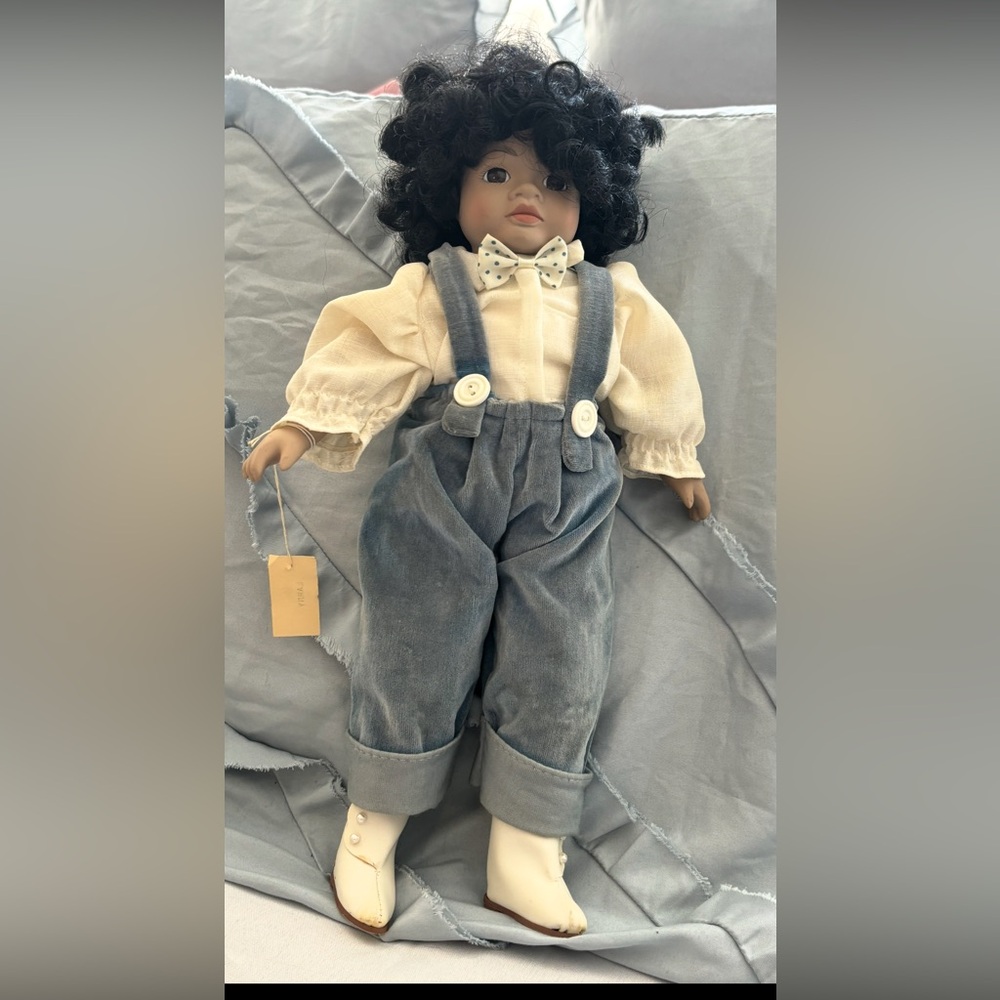 Vintage Porcelain Doll with Blue Overalls